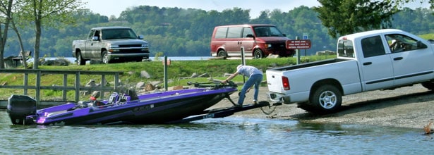 man launching boat from trailer