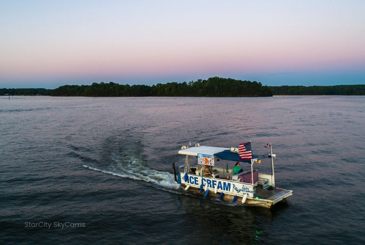 Ice cream boat on Smith Mountain Lake at sunset