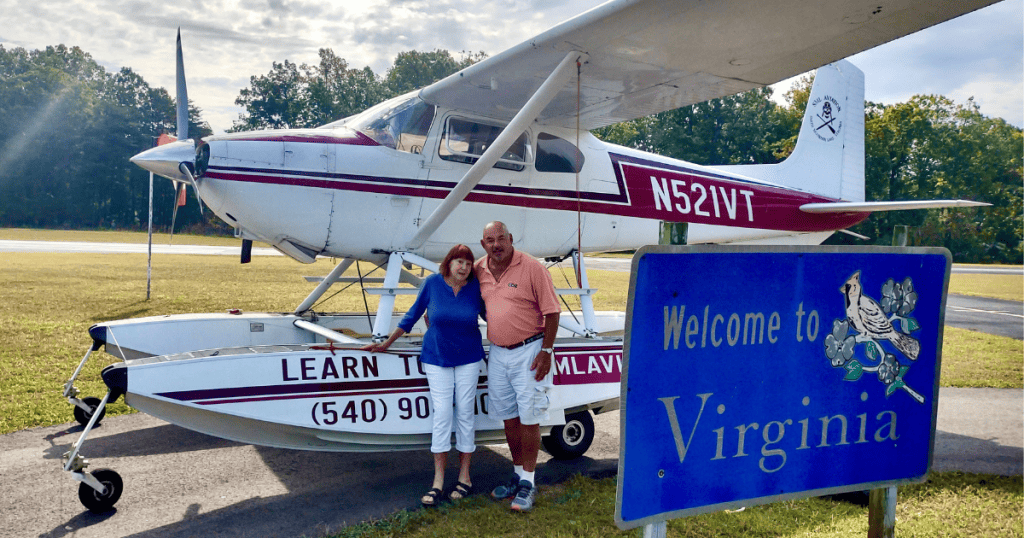 Author Jerry Hale and his wife Ferne in front of the sea plane at Smith Mountain Lake, VA