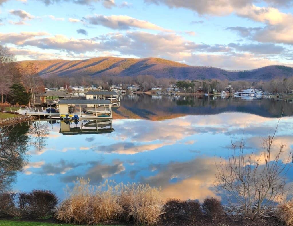 Fluffy white clouds reflected on the smooth surface of Smith Mountain Lake, VA.
