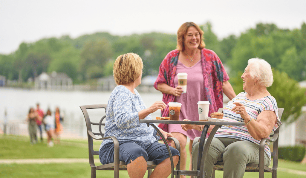 Three ladies enjoying Starbucks coffee with Smith Mountain Lake in the background