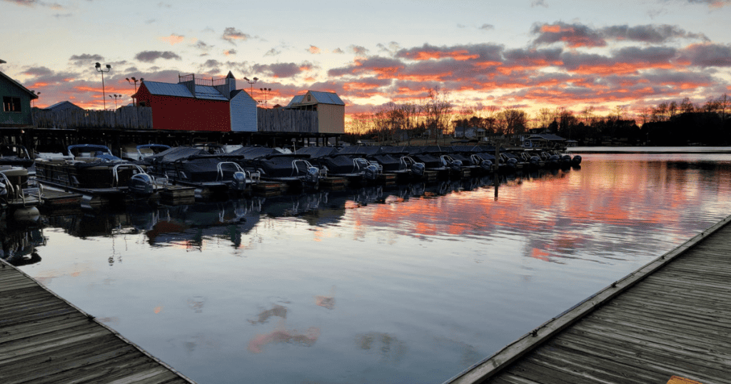 Pink sunrise over the water with the boats of Bridgewater Marina in the backgrounds.