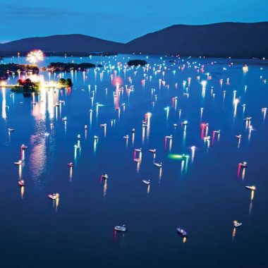 Colorful fireworks light up the sky over the water at Smith Mountain Lake.