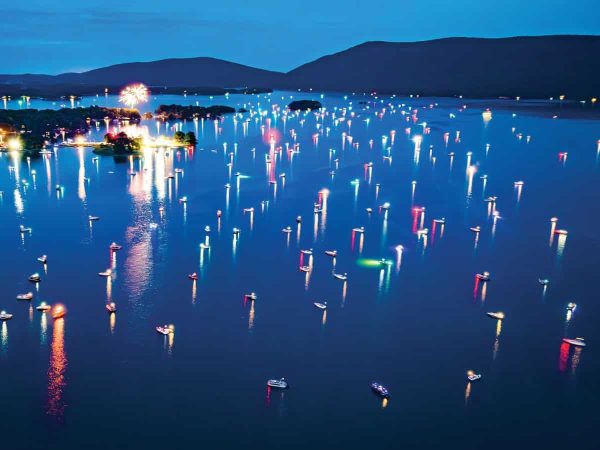 Colorful fireworks light up the sky over the water at Smith Mountain Lake.