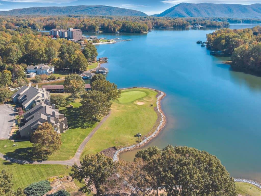 Aerial of a golf hole at Mariners Landing with Smith Mountain and the lake in the background.
