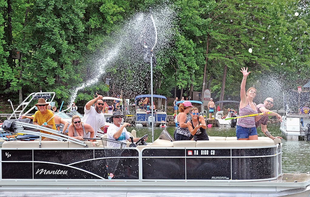 Revelers shoot water cannons during Smith Mountain Lake Pirate DAys.