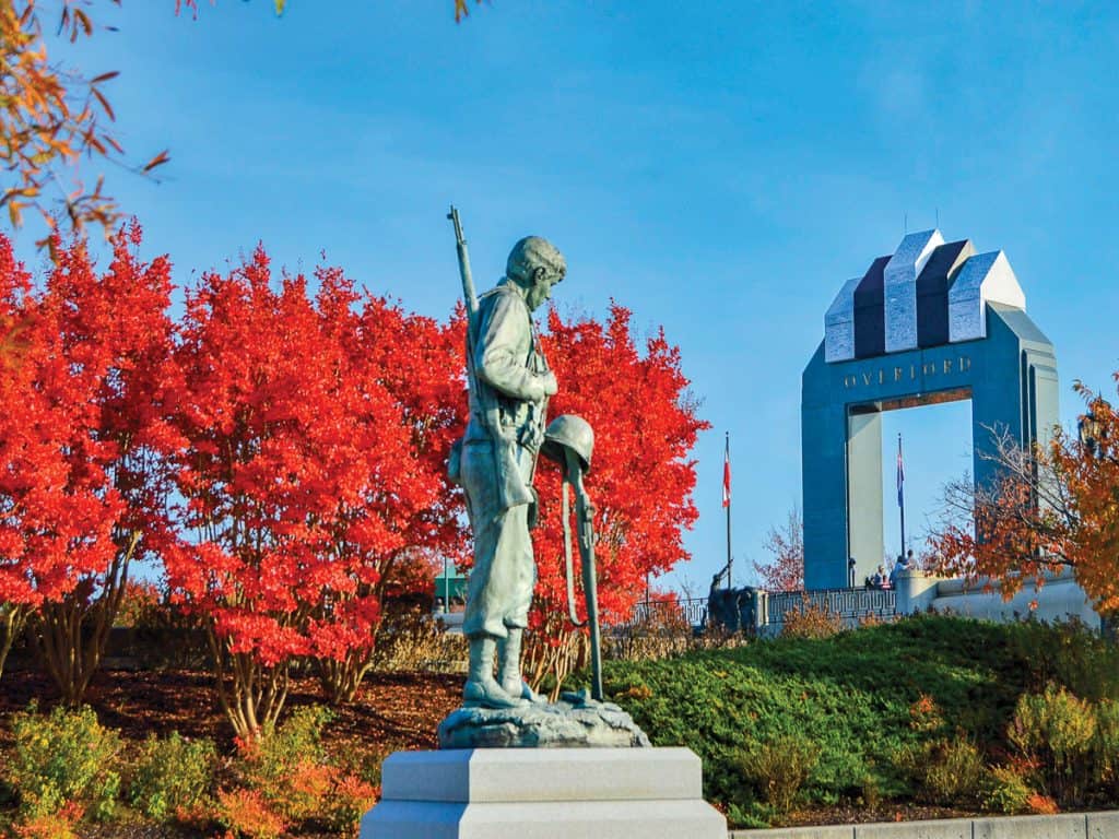 Homage Statue and Overlord Arch in autumn at the National D-Day Memorial in Bedford, VA.