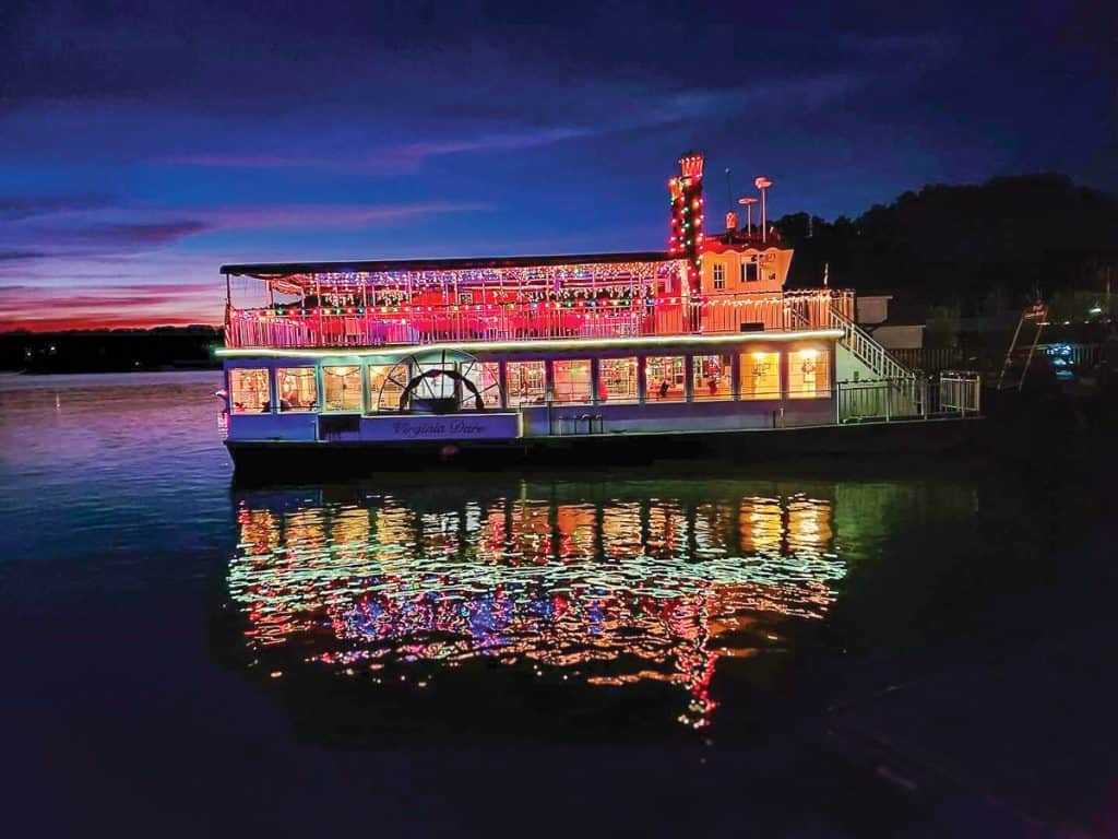 The Virginia Dare, decked out in holiday lights, cruises Smith Mountain Lake, Virginia.