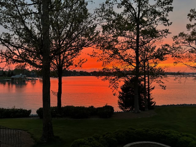 An orange sky illuminates the water at Smith Mountain Lake.