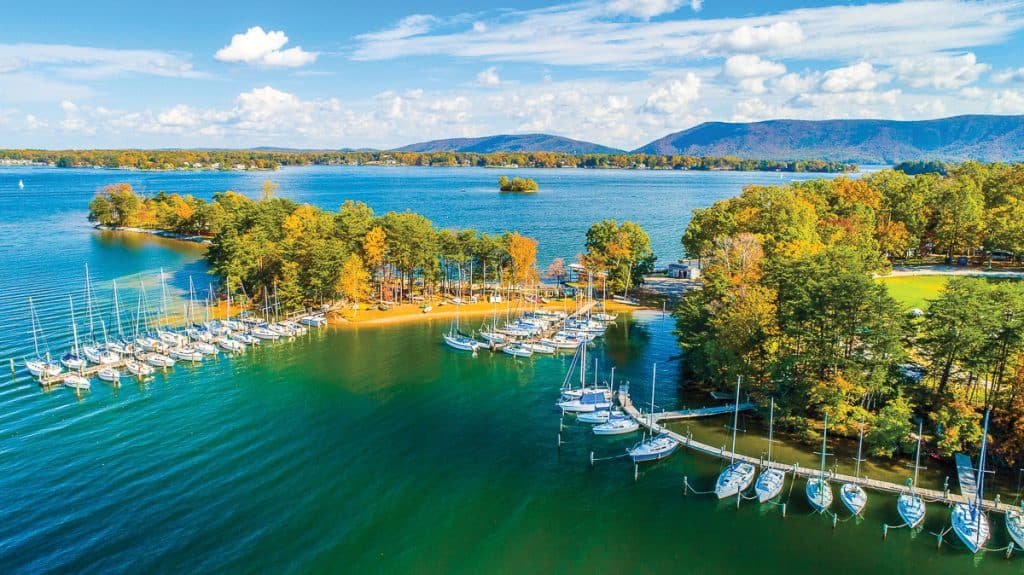 VISA yacht club with fall foliage and mountain in the background at Smith Mountain Lake, VA.