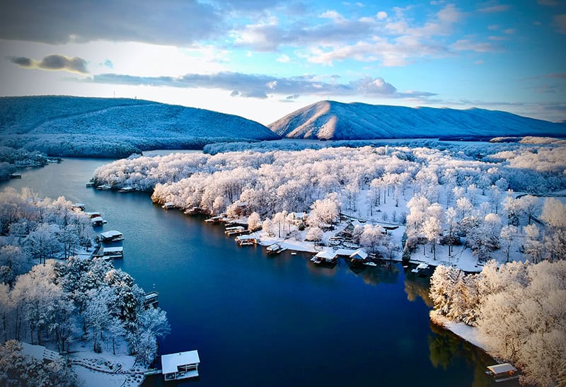 Aerial of Smith Mountain and the lake with snow.