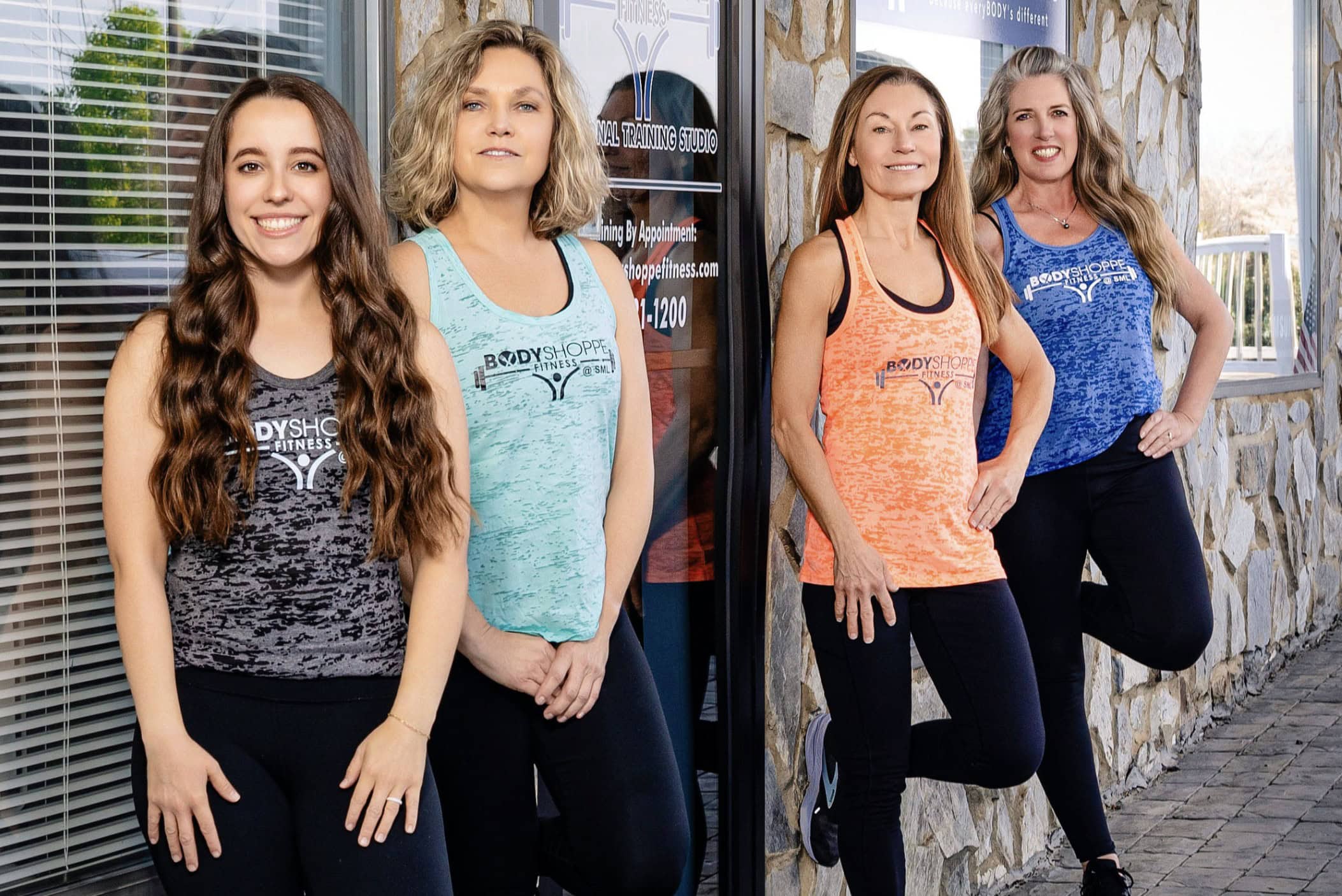 Four personal trainers outside Body Shoppe Fitness, a personal training studio at Smith Mountain Lake, VA.