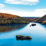Bar Island and Dam Island with fall foliage and Smith Mountain Dam in the background.