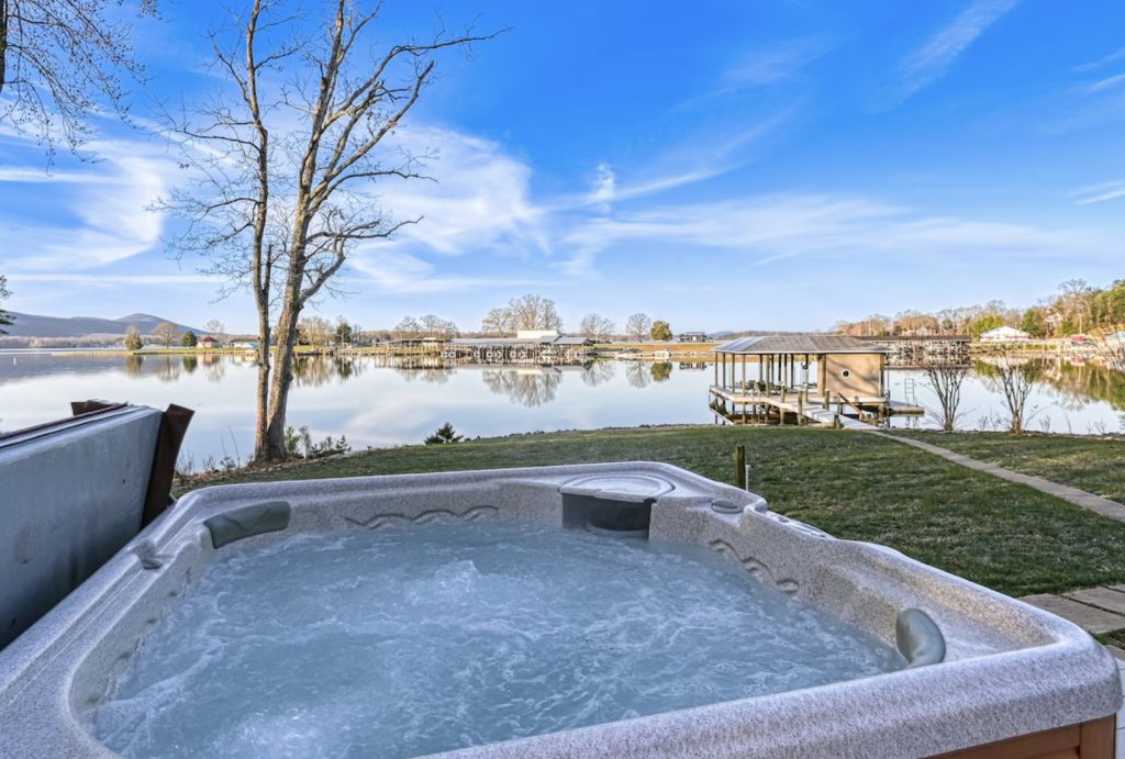 Hot tub overlooking Smith Mountain Lake at a large vacation rental home.