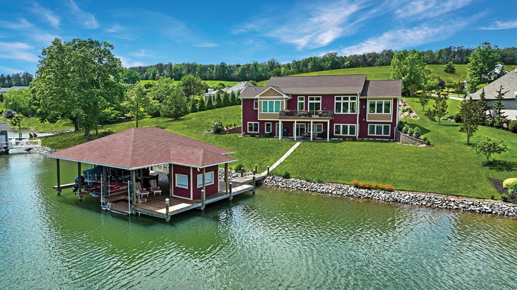 Maroon lakefront home with coordinating boat house on Smith Mountain Lake featured on the charity home tour.
