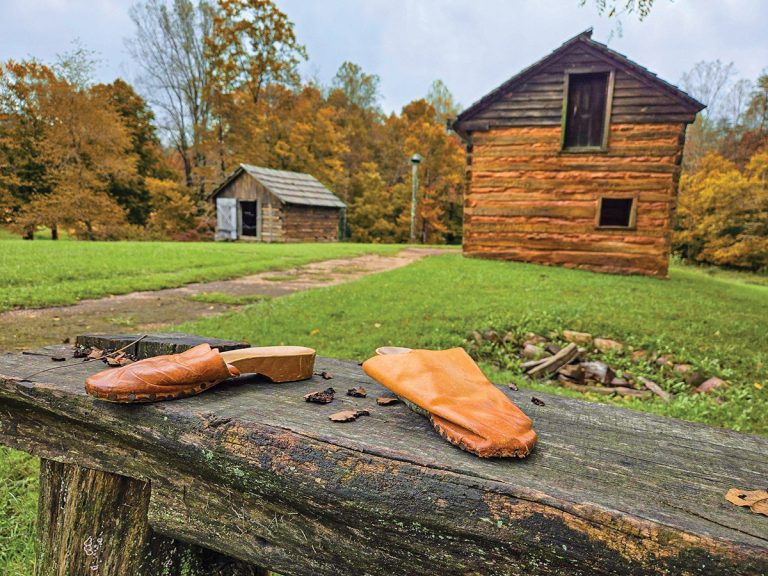 Booker T. Washington National Monument reconstructed cabin and split‑rail fence in Hardy, Virginia, near Smith Mountain Lake.