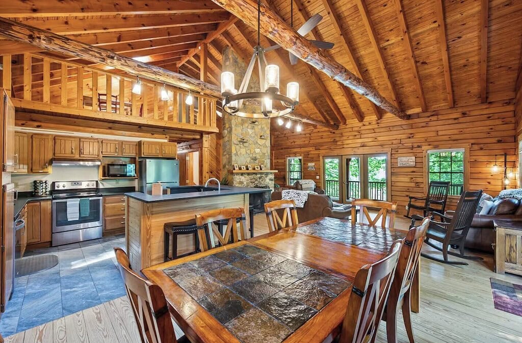 Stunning interior of Smith Mountain Lake cabin with soaring wood ceilings and a view of the water.