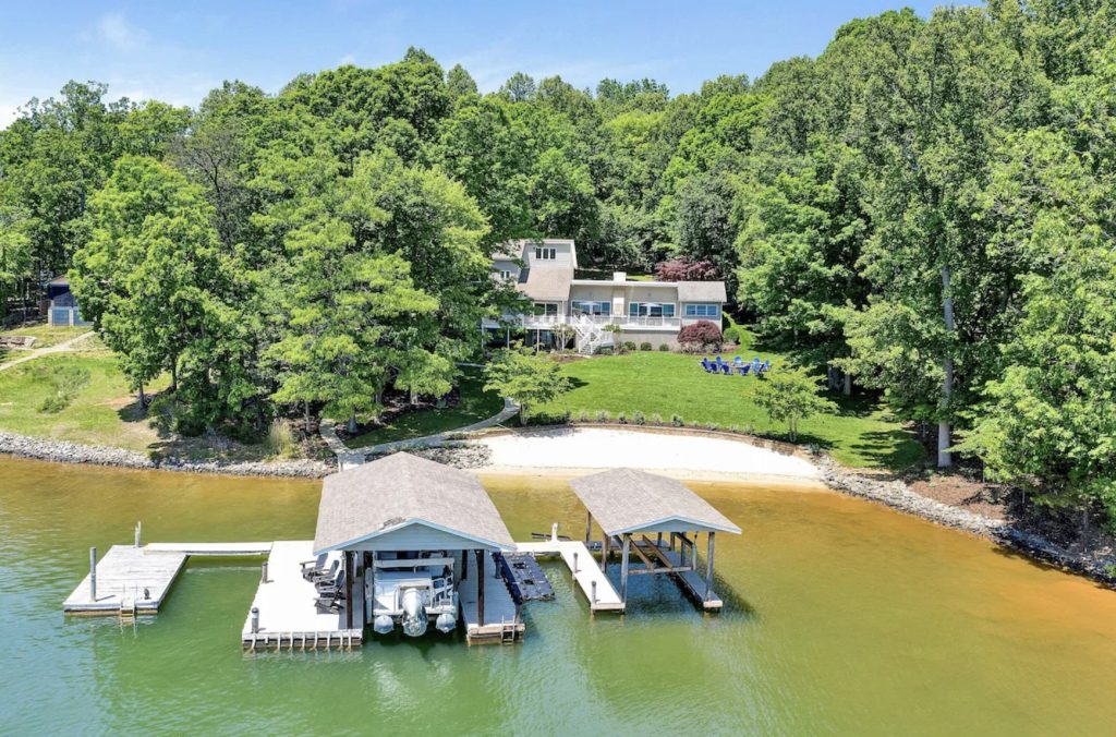 Lakefront home with huge dock and beach used for family reunions and retreats at Smith Mountain Lake, Virginia.