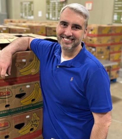 SML Gives founder Joey Donovant in food pantry warehouse.