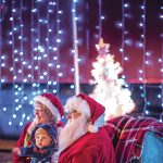 Santa and Mrs. Claus greet children at the Come Home to Franklin County Christmas parade in downtown Rocky Mount