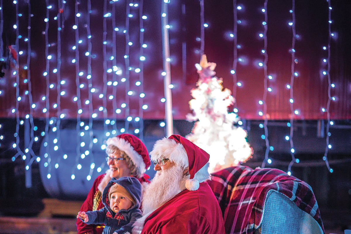 Santa and Mrs. Claus greet children at the Come Home to Franklin County Christmas parade in downtown Rocky Mount