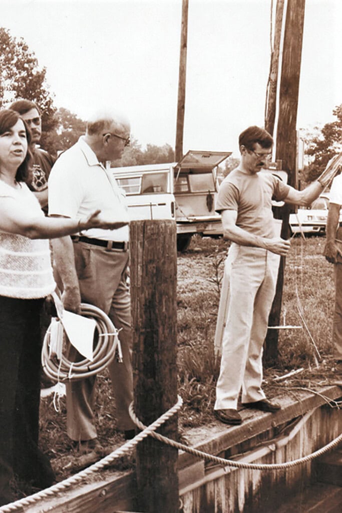 Historical photo from 1987 showing Dr. Carolyn Thomas and Dr. Dave Johnson conducting water quality volunteer training session in 1987.