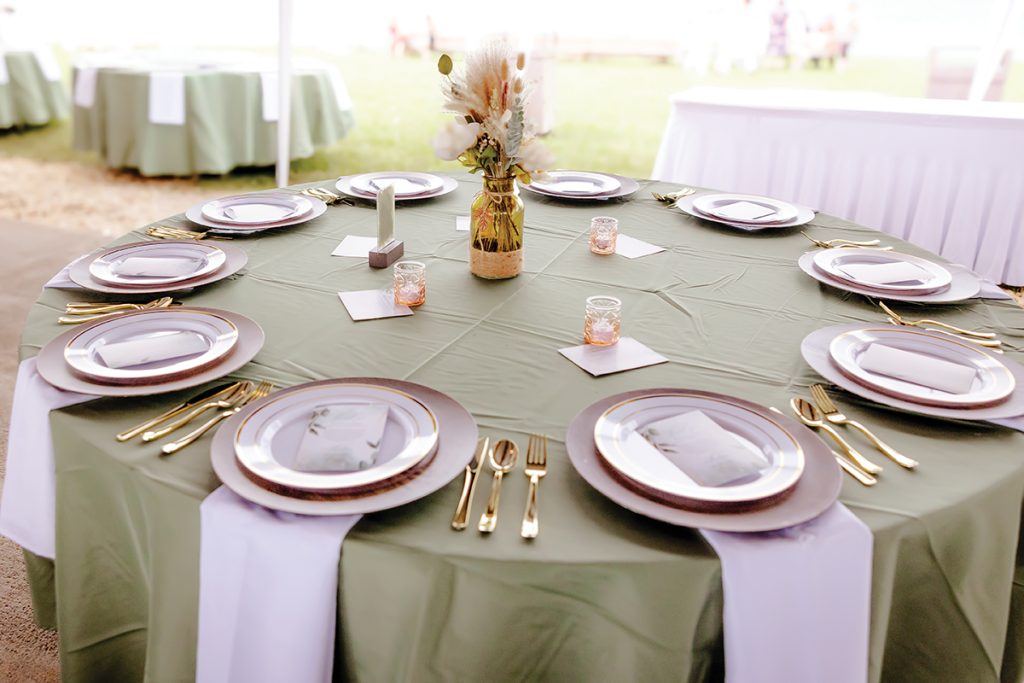 Elegant reception table setting with sage green linens and white place settings at Parkway Marina Smith Mountain Lake