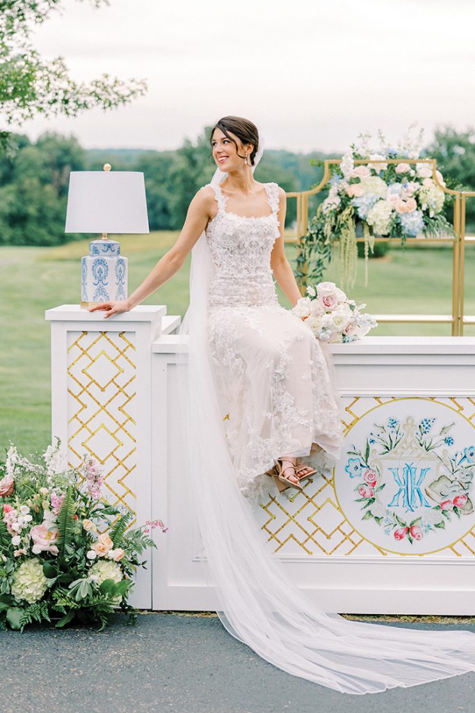 A bride poses with golf and mountain views at The Water’s Edge Country Club at Smith Mountain Lake, photographed by Megan Lampert Photography.