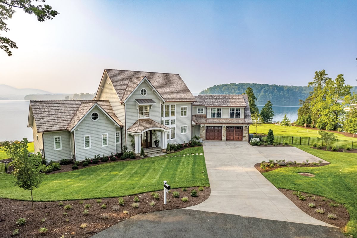 Layered plantings with structured evergreens and perennials near a Smith Mountain Lake home.