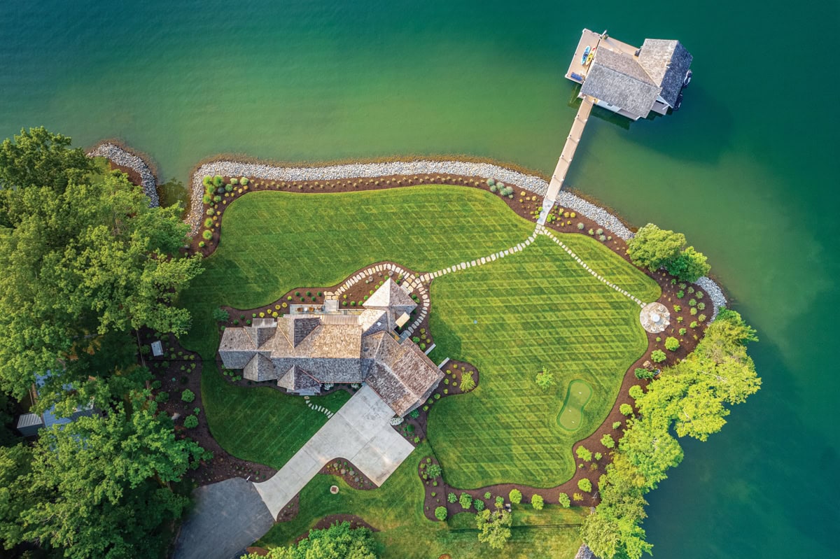 Aerial view of a landscaped lakefront property with multiple outdoor destinations at Smith Mountain Lake.