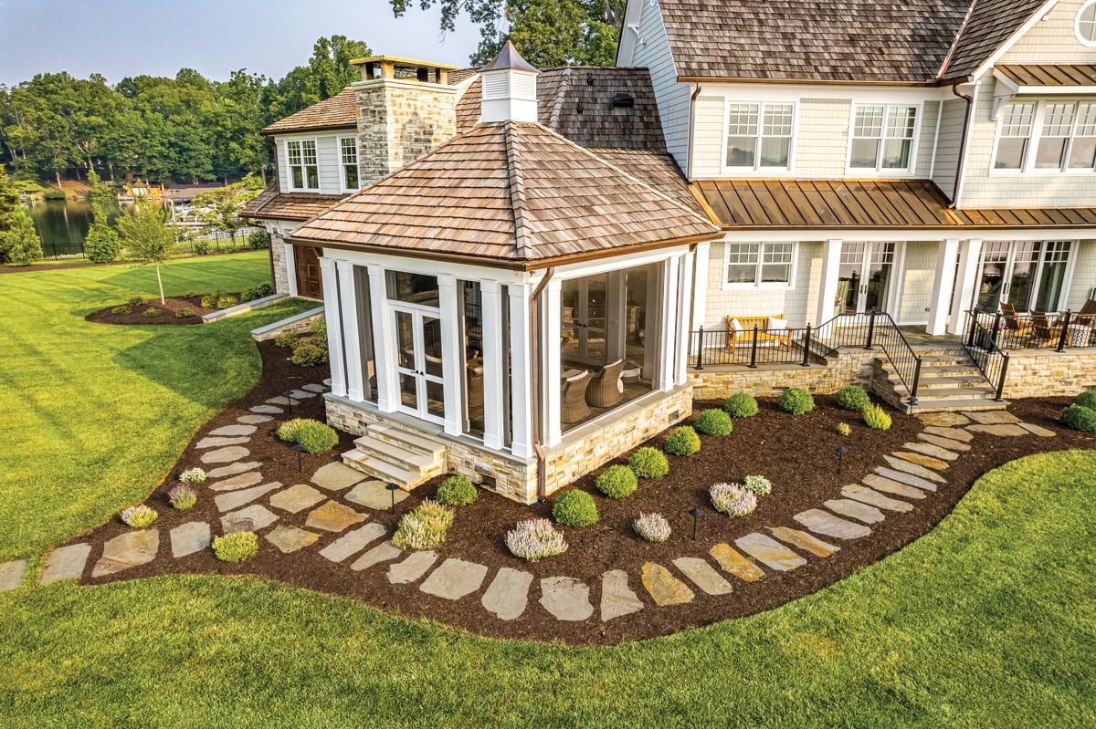 Irregular natural stone stepping stones creating an organic arrival path at Smith Mountain Lake.
