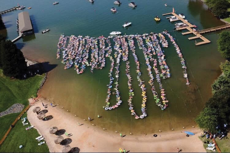 Smith Mountain Lake community members attempting ta Guinness World Record attempt for most people floating in a single, continuous line during the 50th anniversary year in 2016.