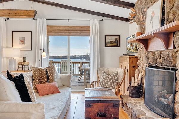 Vintage and repurposed furnishings that keep camp-style charm in a remodeled lake cottage.