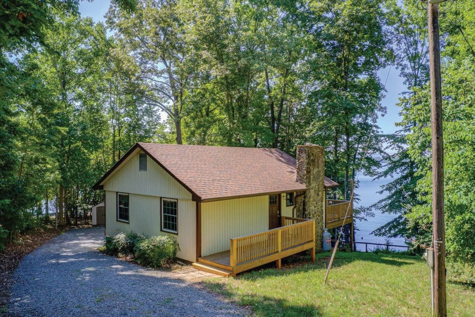 Dated lakeside cottage before renovation.