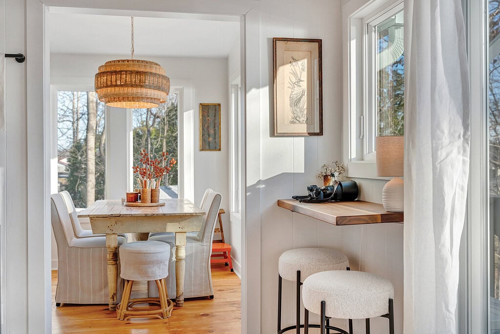 Dining area bump-out with a wall of windows overlooking the lake in Moneta, Virginia.