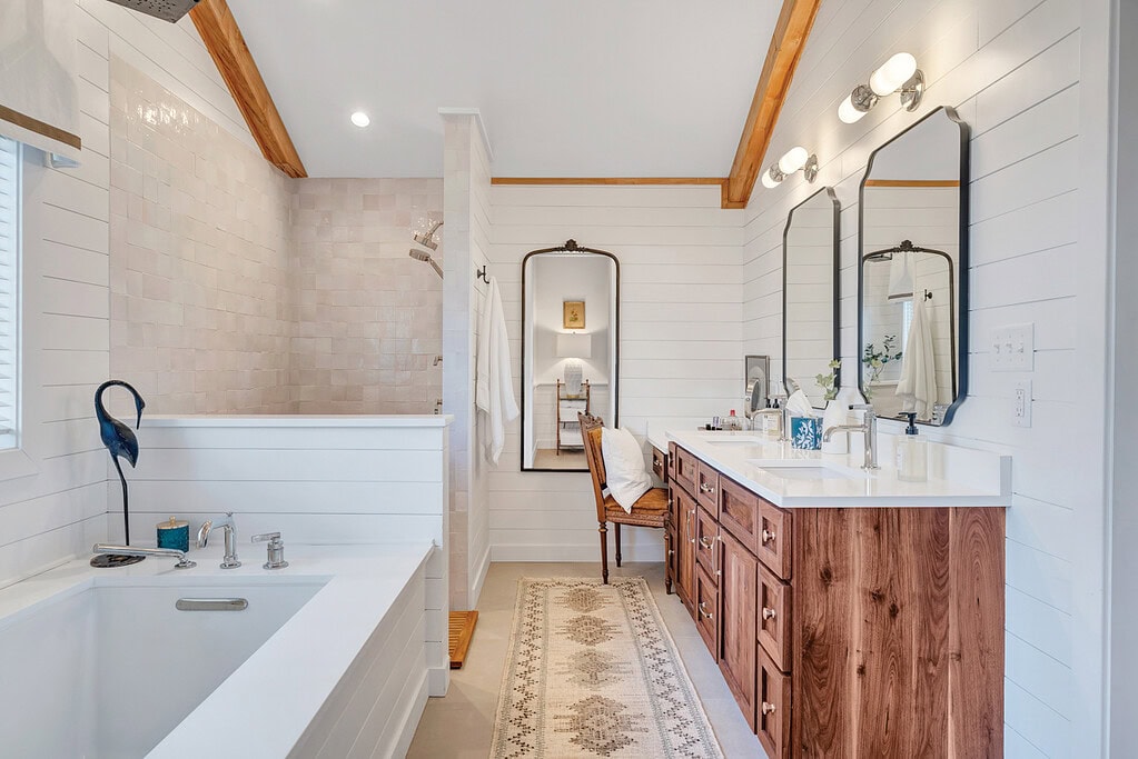 Heated-floor primary bathroom upgrade designed for comfort and longevity in a lake house renovation.
