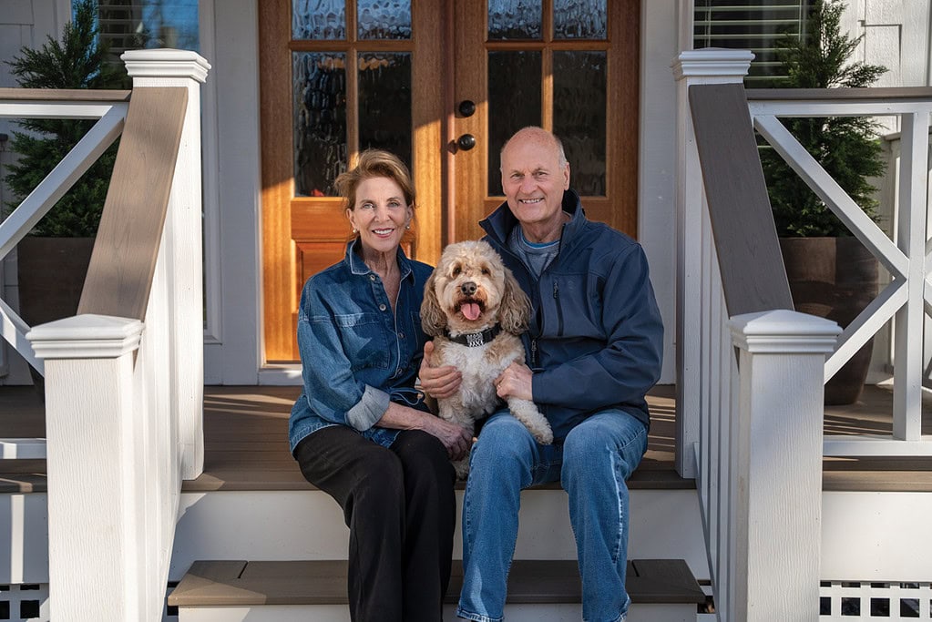 Homeowners Dori and Larry Witek with their bernedoodle, Tate.