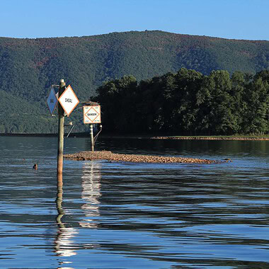 A channel marker is exposed during low water at Smith Mountain Lake, VA.