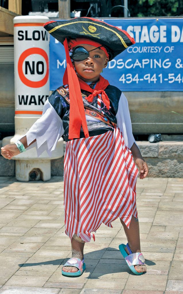 Little boy on dock dressed as a pirate for SML Pirate Days.