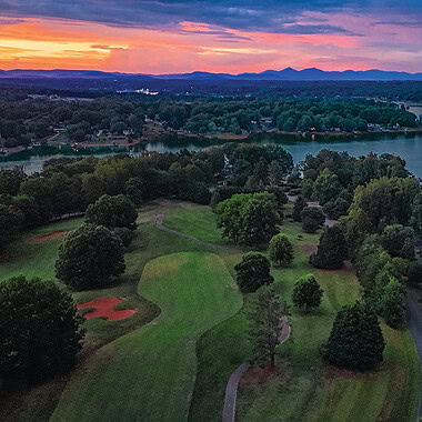 An aerial view at sunrise of holes 5 and 6 at The Waterfront Country Club at Smith Mountain Lake, Virginia.
