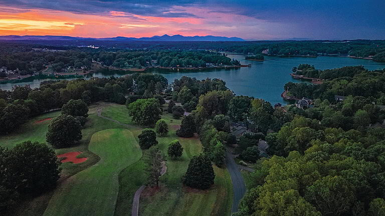 An aerial view at sunrise of holes 5 and 6 at The Waterfront Country Club at Smith Mountain Lake, Virginia.
