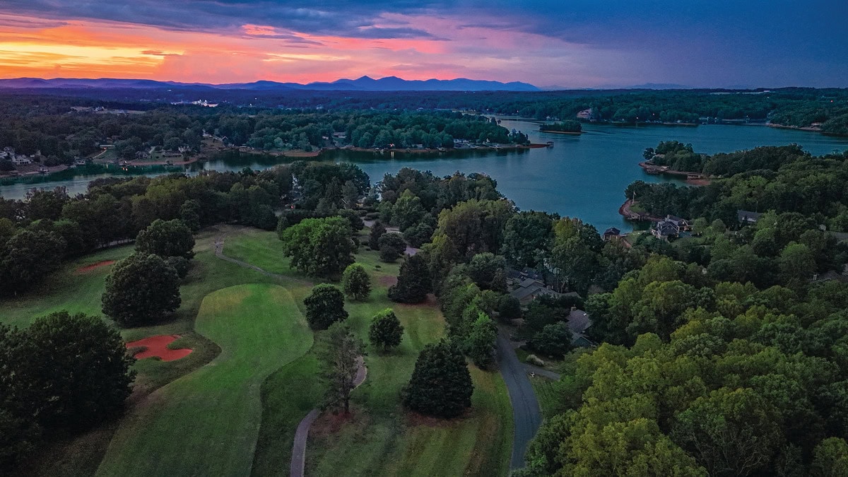 An aerial view at sunrise of holes 5 and 6 at The Waterfront Country Club at Smith Mountain Lake, Virginia.
