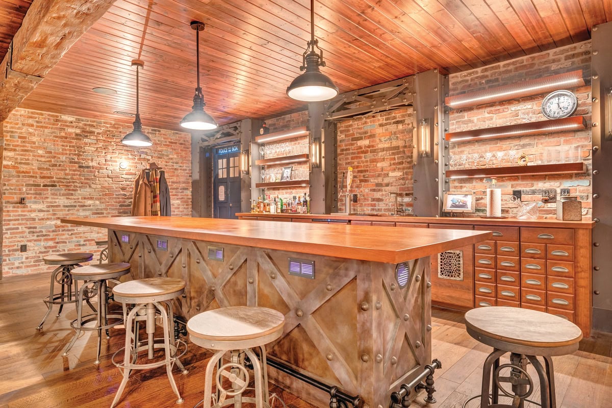 The Steel'n Time Lounge speakeasy with brick walls and hollowed-out oak beams.
