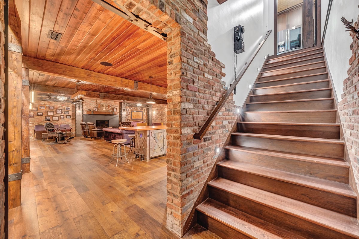 Stairs descending from the Bourbon Barn to the Speakeasy at the LaBella's property on the SML Charity Home Tour.