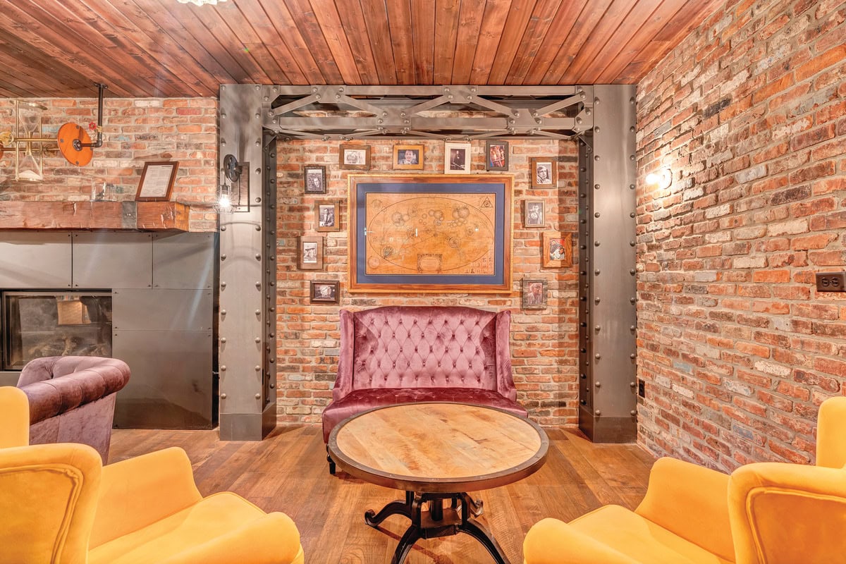 A wall in the speakeasy displays vintage-style black-and-white photos of time travelers and innovators and a time traveler map.