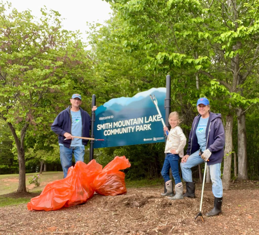Volunteers with Take Pride in Smith Mountain Lake with tools and bags of debris