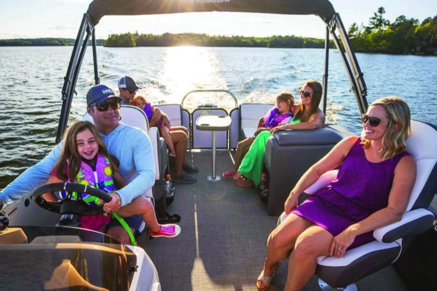 Family enjoying a pontoon boat through Bridgewater Boat Club