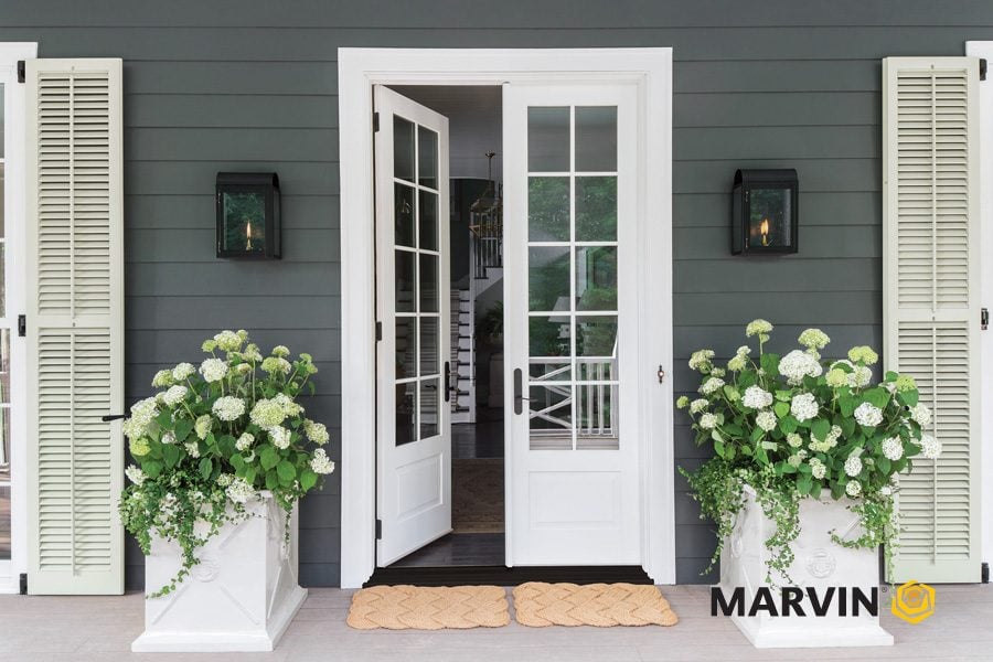 Marvin entry door and energy-efficient replacement windows on a custom home exterior