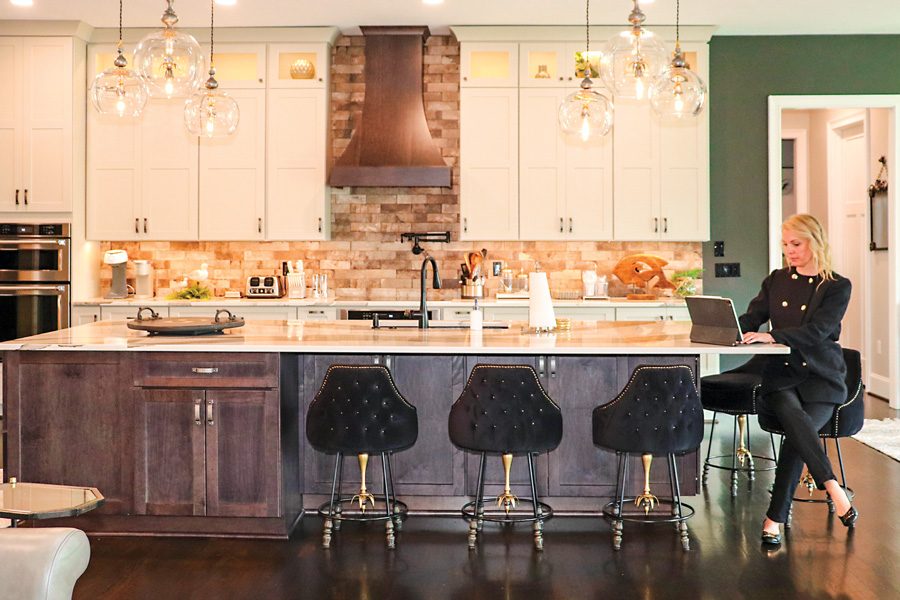 Jada Turner meeting with clients inside a high-end lake home during a real estate consultation